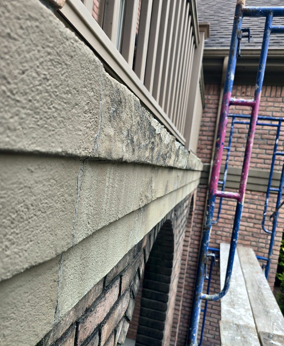 Residence, Schenectady - Cracked EIFS band before repair, 2026.