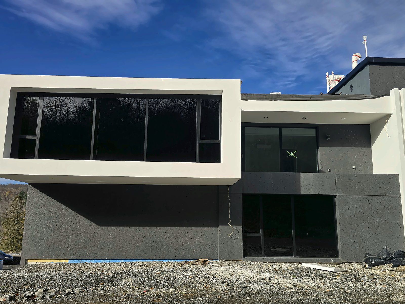 Finished two-tone EIFS facade on a modern residence built by our crew