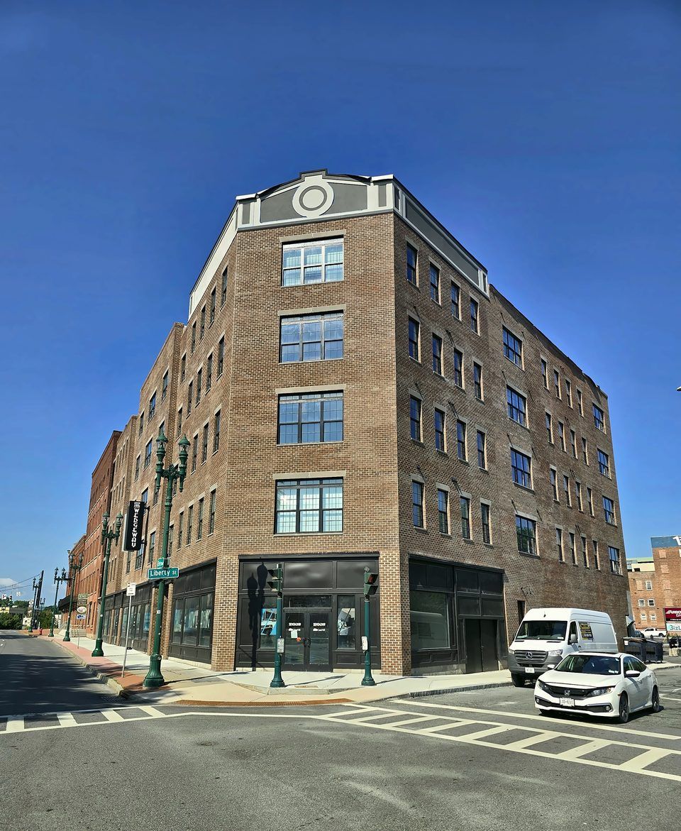 State Street, Schenectady - Prefabricated EIFS panel band on a mixed-use building, installed from lifts, 2026.